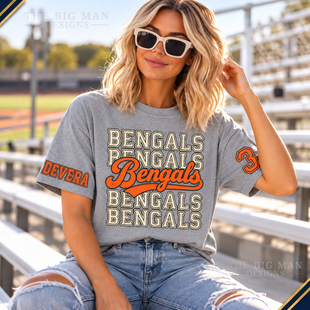 Heather gray Bengals T-shirt worn at sports bleachers, showing custom sample name DEVERA on right upper sleeve and number 3 on left upper sleeve.