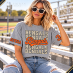 Heather gray Bengals T-shirt worn at sports bleachers, showing custom sample name DEVERA on right upper sleeve and number 3 on left upper sleeve.
