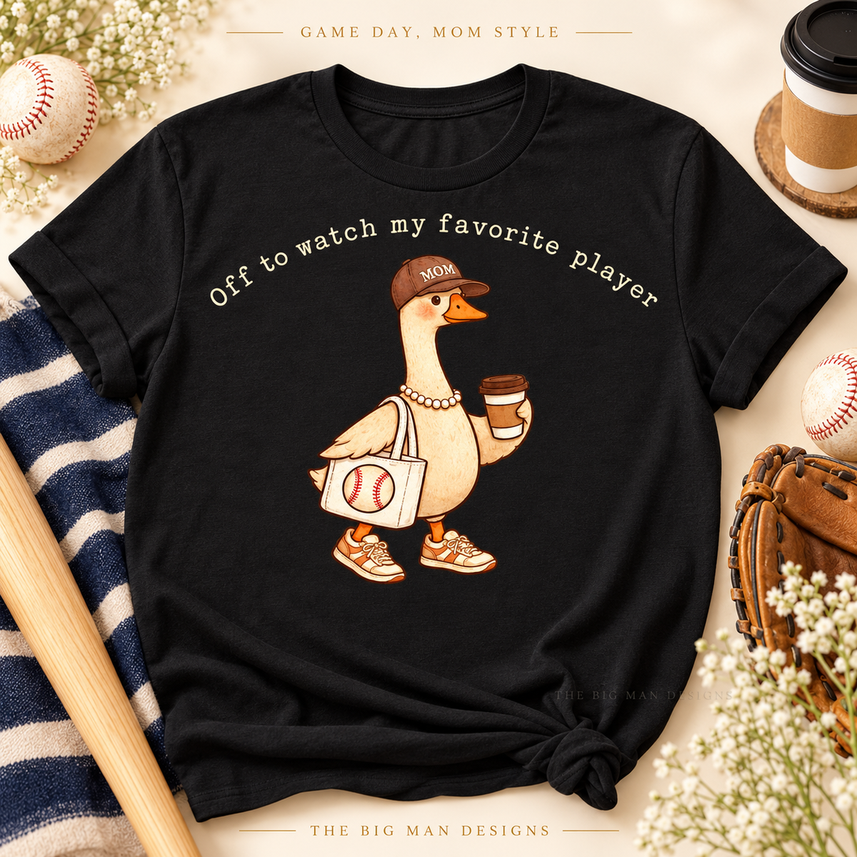 Black Baseball Mom Goose T-shirt with cream Off to watch my favorite player lettering, styled with baseball and coffee accessories.