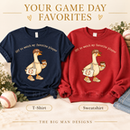 Baseball Mom Goose artwork on a navy T-shirt and a red sweatshirt, showing available garment styles. The Big Man Designs.