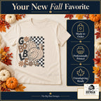 Gobble Leopard Turkey Thanksgiving design. Natural T-shirt with made-to-order and professional-printing benefit badges. The Big Man Designs.