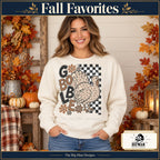 Gobble Leopard Turkey Thanksgiving design. Woman wearing the design on a Natural crewneck sweatshirt. The Big Man Designs.