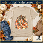 Give Thanks Leopard Bow Thanksgiving design. Natural T-shirt styled with fall boutique accessories. The Big Man Designs.