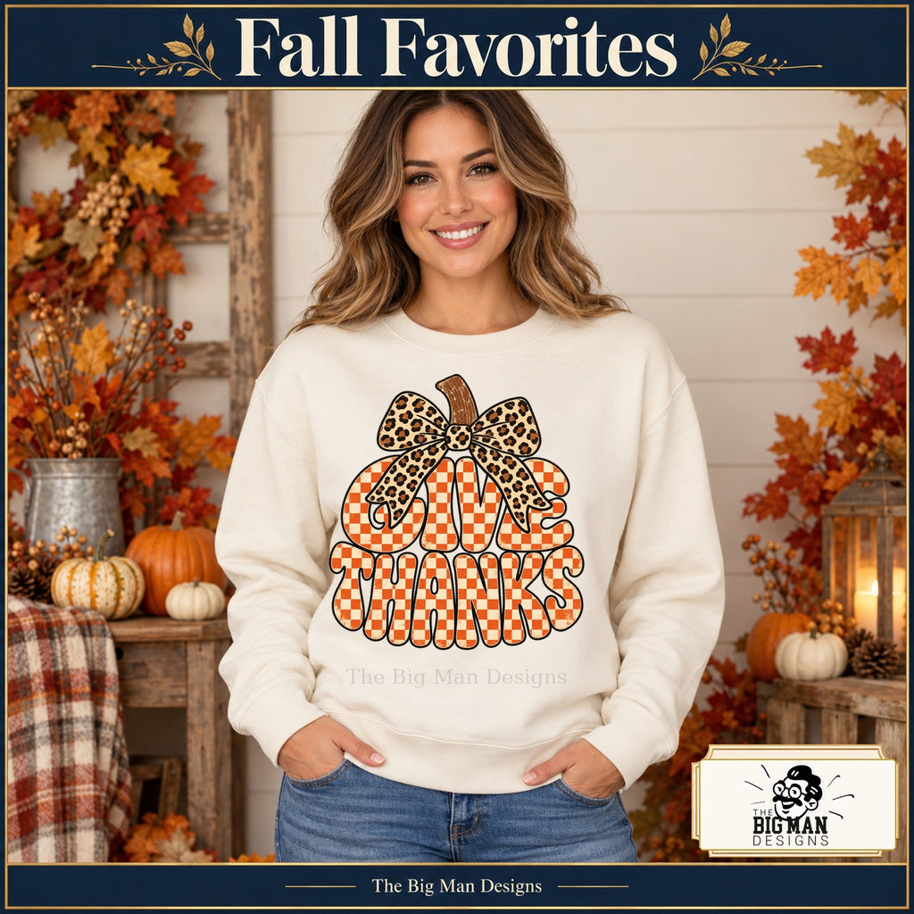 Give Thanks Leopard Bow Thanksgiving design. Woman wearing the design on a Natural crewneck sweatshirt. The Big Man Designs.