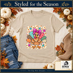 Cute Turkey Pink Bow Thanksgiving design. Natural T-shirt styled with fall boutique accessories. The Big Man Designs.