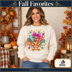 Cute Turkey Pink Bow Thanksgiving design. Woman wearing the design on a Natural crewneck sweatshirt. The Big Man Designs.
