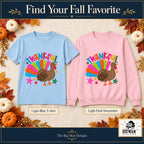 Thankful Colorful Turkey front design on a Light Blue T-shirt and Light Pink sweatshirt, The Big Man Designs branded color mockup