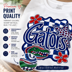 A white crewneck sweatshirt featuring a large Gators graphic print with blue, red, and white colors. The graphic includes the word 'Gators' in bold blue letters, a red alligator head, a red flower, and a blue-and-white checkered border.