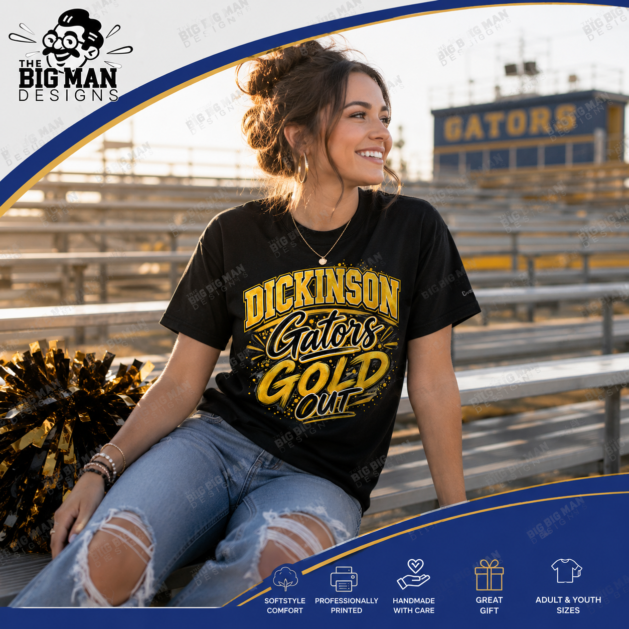 A woman sitting on stadium bleachers at a football game wearing a black graphic t-shirt that reads 'DICKINSON Gators GOLD Out'. The background shows stadium seating and a 'GATORS' building in the distance.
