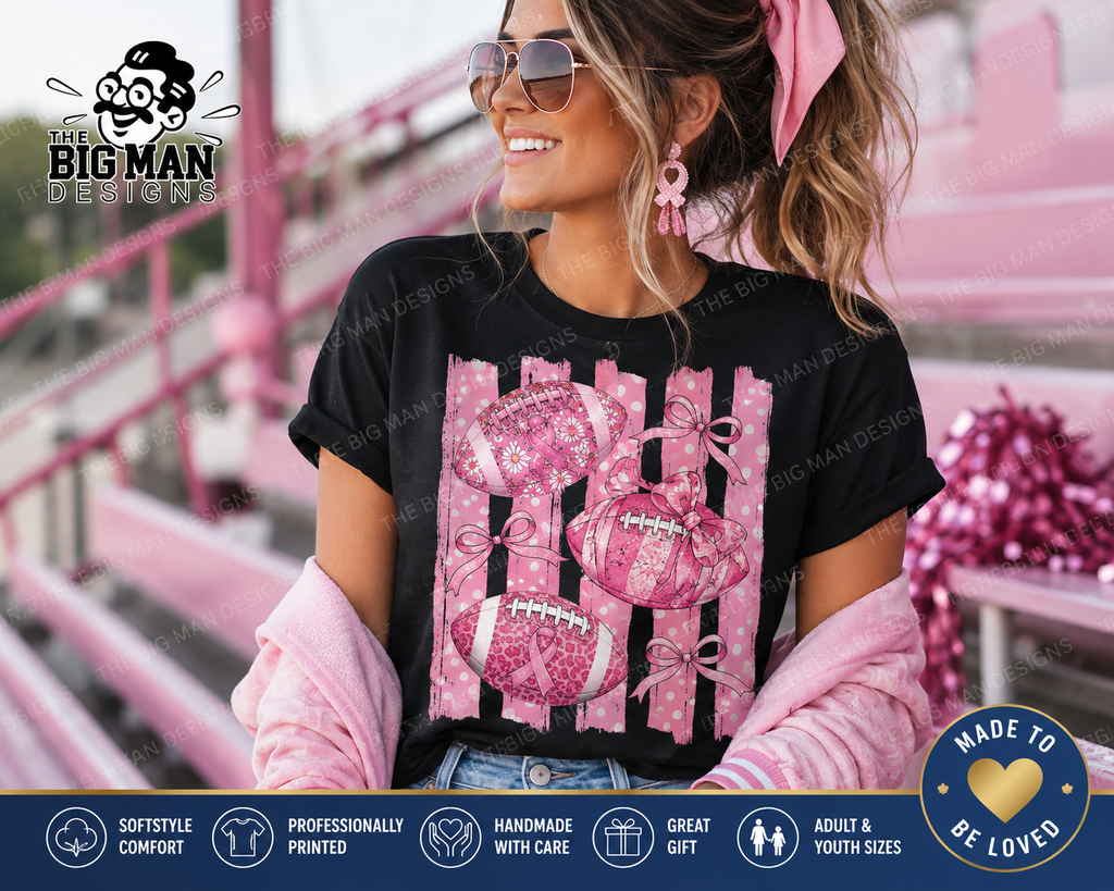 A woman wearing a black graphic t-shirt with a pink and white football-themed fence design, styled with pink accessories in a pink environment. The image includes a 'The Big Man Design' logo and a 'Made to Be Loved' badge.
