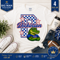 A white Gildan t-shirt shown in a flat lay with jeans, sneakers, a football, a coffee cup, and decorative text overlays. The shirt features a graphic with a blue checkerboard 'D', the name 'Dickinson' in red script, and a green alligator wearing a blue 'D' jersey.