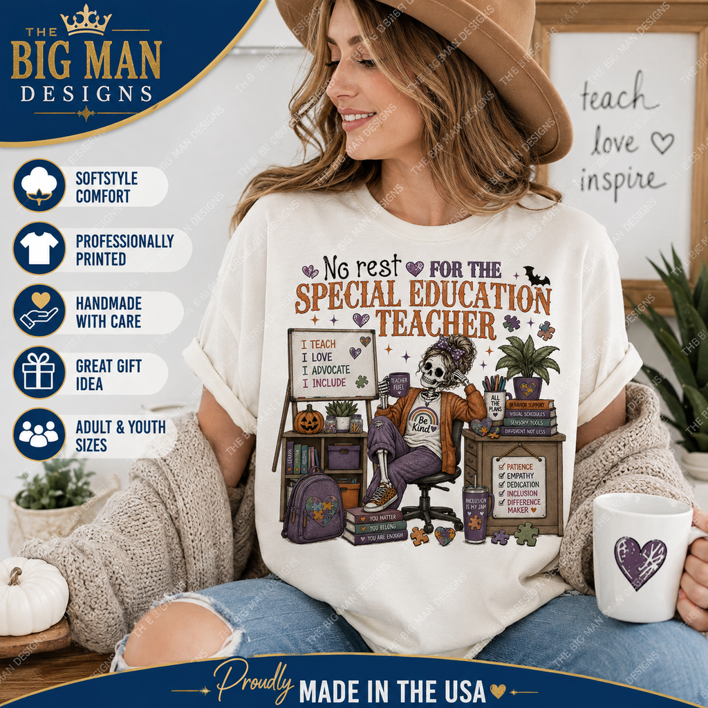 A woman wearing a cream graphic t-shirt with a Halloween-themed skeleton teacher design, sitting in a cozy room setting and holding a mug. The image includes promotional text overlays and badges for 'The Big Man Designs'.