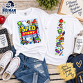 Two white graphic T-shirts shown flat-laid on a styled desk surface, with the front and back designs visible. The shirts feature colorful school-themed illustrations and text including 'SPED STORY' and educational icons.