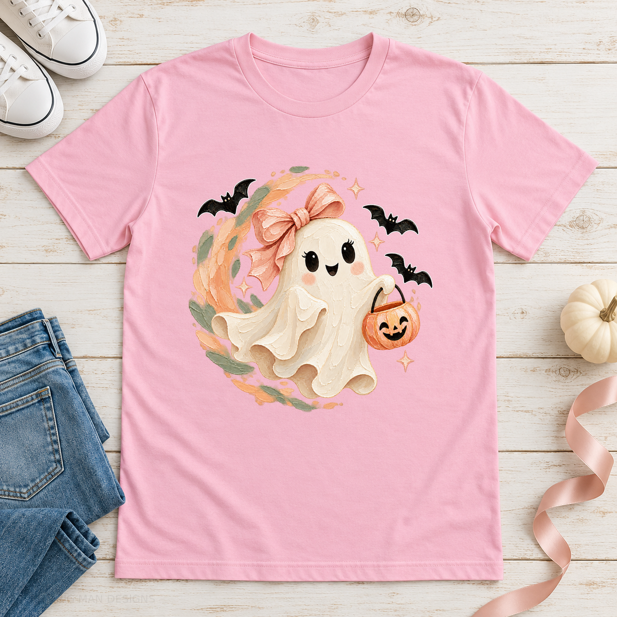 Light pink ghost Halloween tee styled with jeans, white sneakers, and a cream pumpkin.