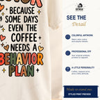 Cropped detail of the behavior plan lettering and leopard coffee artwork printed on natural shirt fabric.