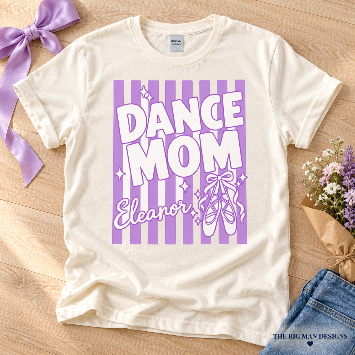 Natural Dance Mom Eleanor shirt flat lay with lavender ribbon and recital bouquet