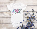 Bring the magic of the sea to your little one with our Peace Love Mermaid baby bodysuit or onesie! This adorable design is perfect for baby girls who love mermaids and all things magical. Whether you're celebrating a birthday or just looking for a cute outfit, this onesie is a must-have! Made from soft, 100% cotton Gerber brand onesies, it's designed for ultimate comfort. includes faux glitter