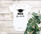 Celebrate your little one's milestone with our NICU Graduate Baby Bodysuit/Onesie! Made with soft, 100% cotton Gerber brand onesies, this onesie is perfect for marking the end of an incredible journey. Comfort and durability are key, and you can trust Gerber's quality.