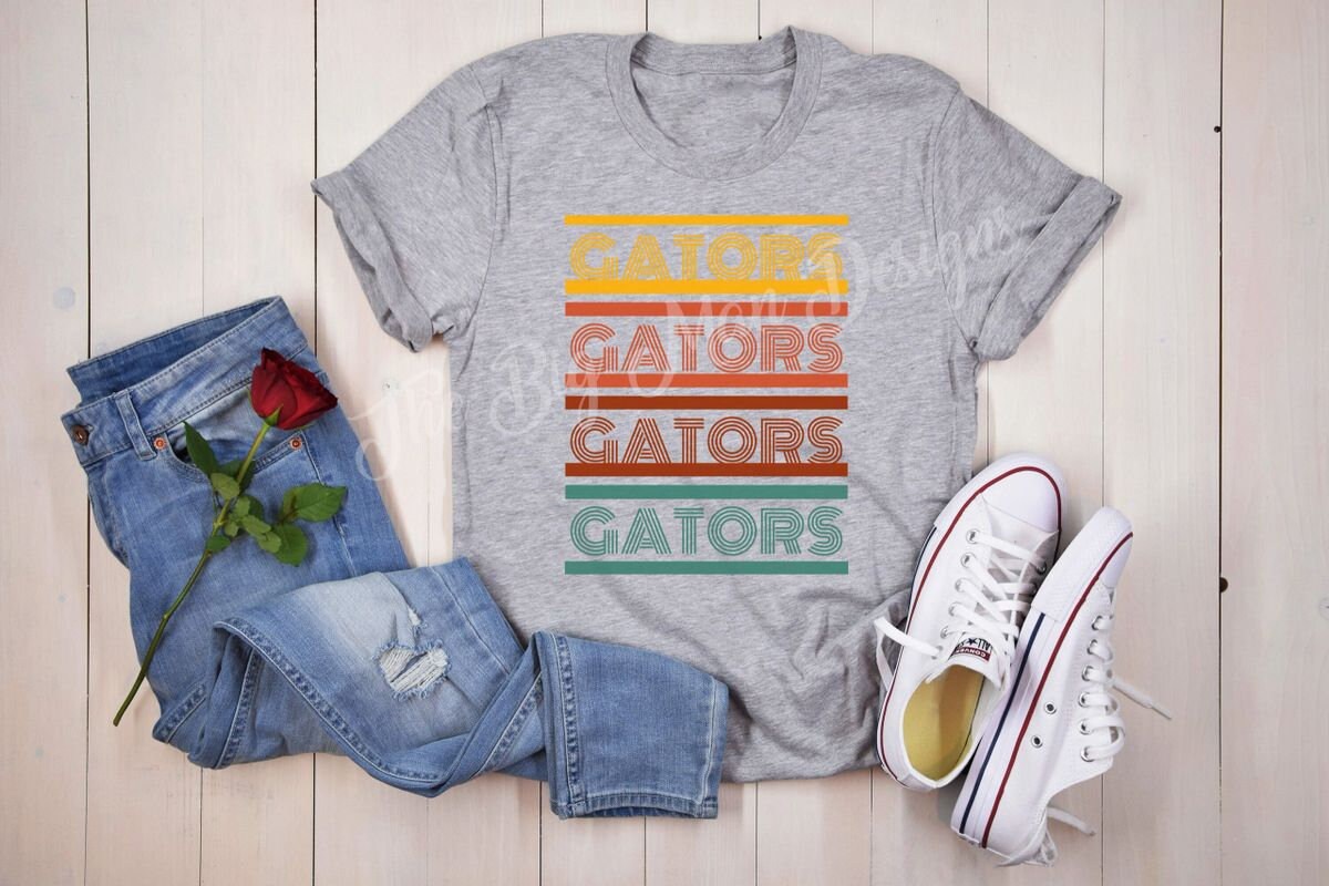 Retro Gators T-Shirt | Dickinson Gators Vintage Tee

🐊 Show Your Gator Pride in Retro Style! 🐊

Support the Dickinson Gators with this stylish Retro Gators T-Shirt! Featuring the word "Gators" in bold, vintage-inspired lettering with a colorful yellow, orange, red, and green gradient, this tee is perfect for game days, spirit wear, or everyday casual style.