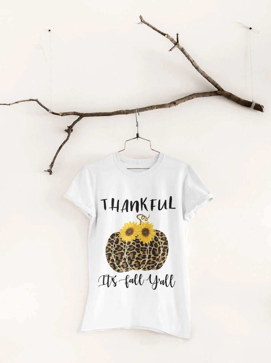 Thankful It’s Fall Y’all - Leopard Pumpkin & Sunflowers T-Shirt

🍂 Welcome Autumn in Style! 🍂

Celebrate the cozy vibes of fall with our "Thankful It’s Fall Y’all" t-shirt! This charming design features a trendy leopard-print pumpkin adorned with vibrant sunflowers, making it the perfect addition to your autumn wardrobe. Ideal for pumpkin patch visits, Thanksgiving gatherings, or simply enjoying a crisp fall day.
