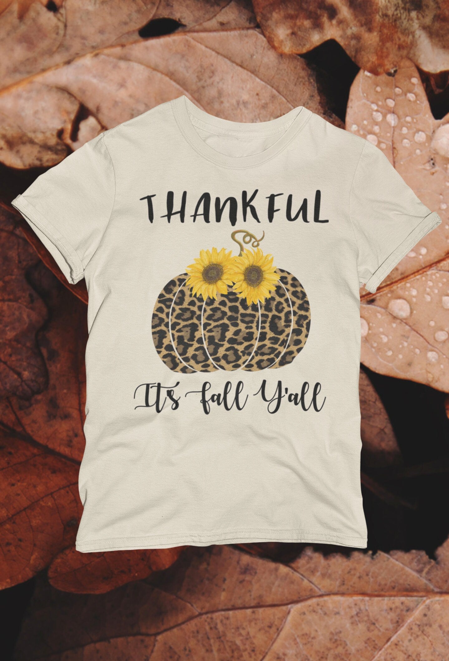 Thankful It’s Fall Y’all - Leopard Pumpkin & Sunflowers T-Shirt

🍂 Welcome Autumn in Style! 🍂

Celebrate the cozy vibes of fall with our "Thankful It’s Fall Y’all" t-shirt! This charming design features a trendy leopard-print pumpkin adorned with vibrant sunflowers, making it the perfect addition to your autumn wardrobe. Ideal for pumpkin patch visits, Thanksgiving gatherings, or simply enjoying a crisp fall day.