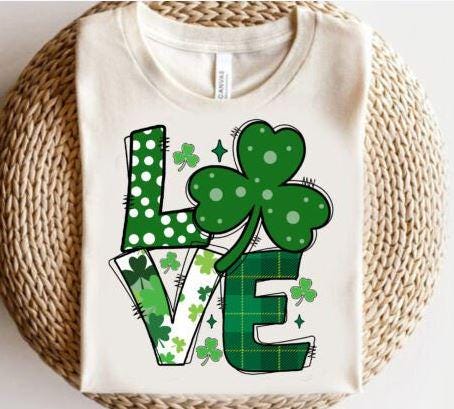 Celebrate St. Patrick’s Day with this adorable "Love" DTF transfer featuring a shamrock as the O in the word “Love”! This festive green design combines the spirit of the holiday with the cuteness of a shamrock, making it perfect for creating lucky St. Patrick's Day outfits. Whether you're heading to a celebration or just want to add a little festive charm to your wardrobe, this ready-to-press DTF transfer is the perfect way to bring some luck and love into your day! on white sw