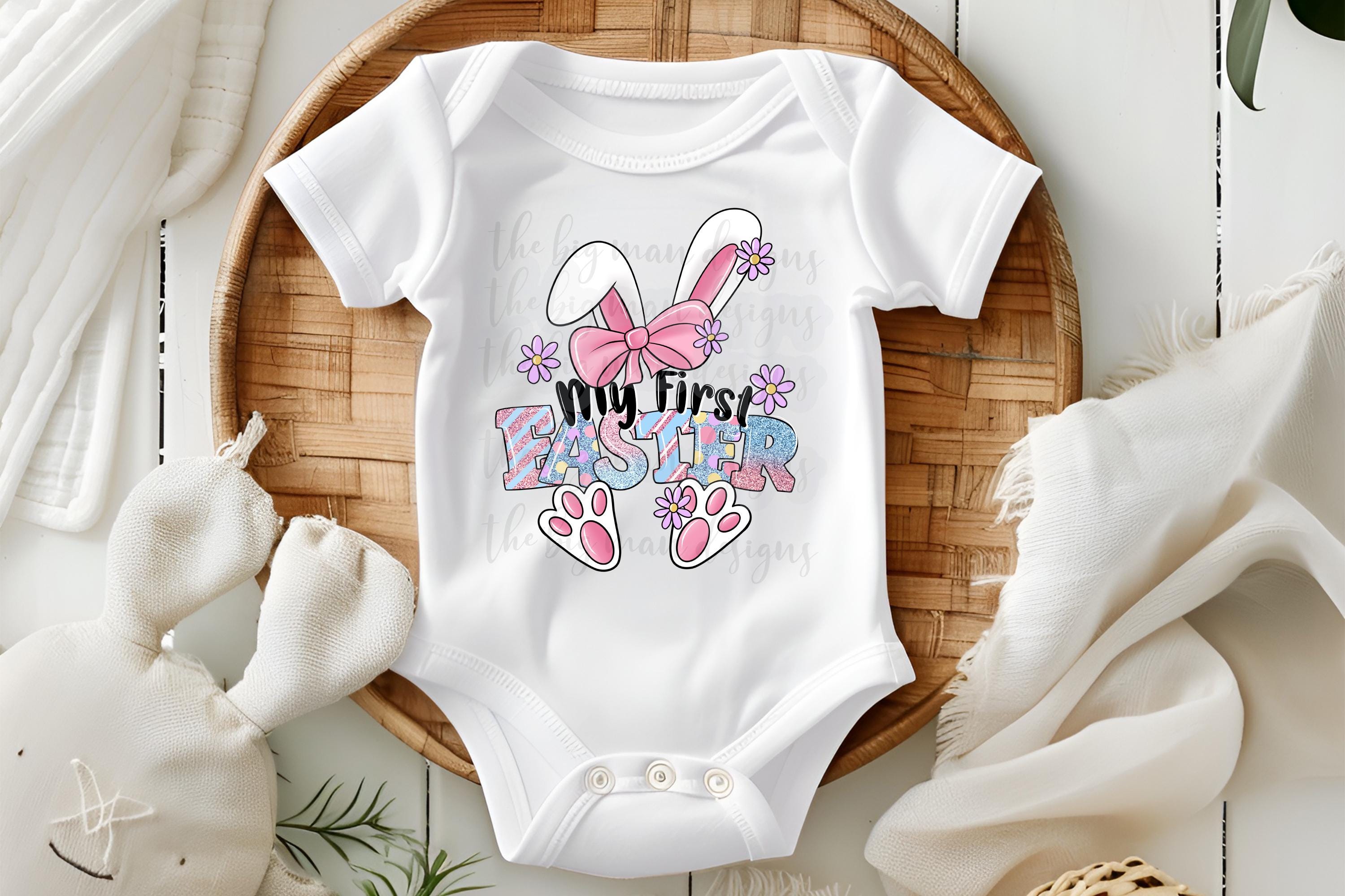 My first Easter onesie with faux glitter available in white, pink, grey, blue, and black. This cute design features bunny ears, a bow, cute feet, and adorable flowers. Easter is in pastels with faux glitte.