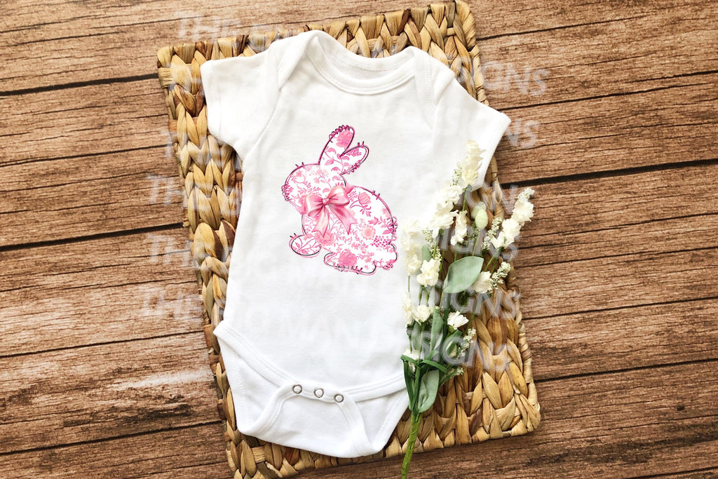 Floral pink toile bunny onesie, featuring an elegant vintage design, perfect for Easter.