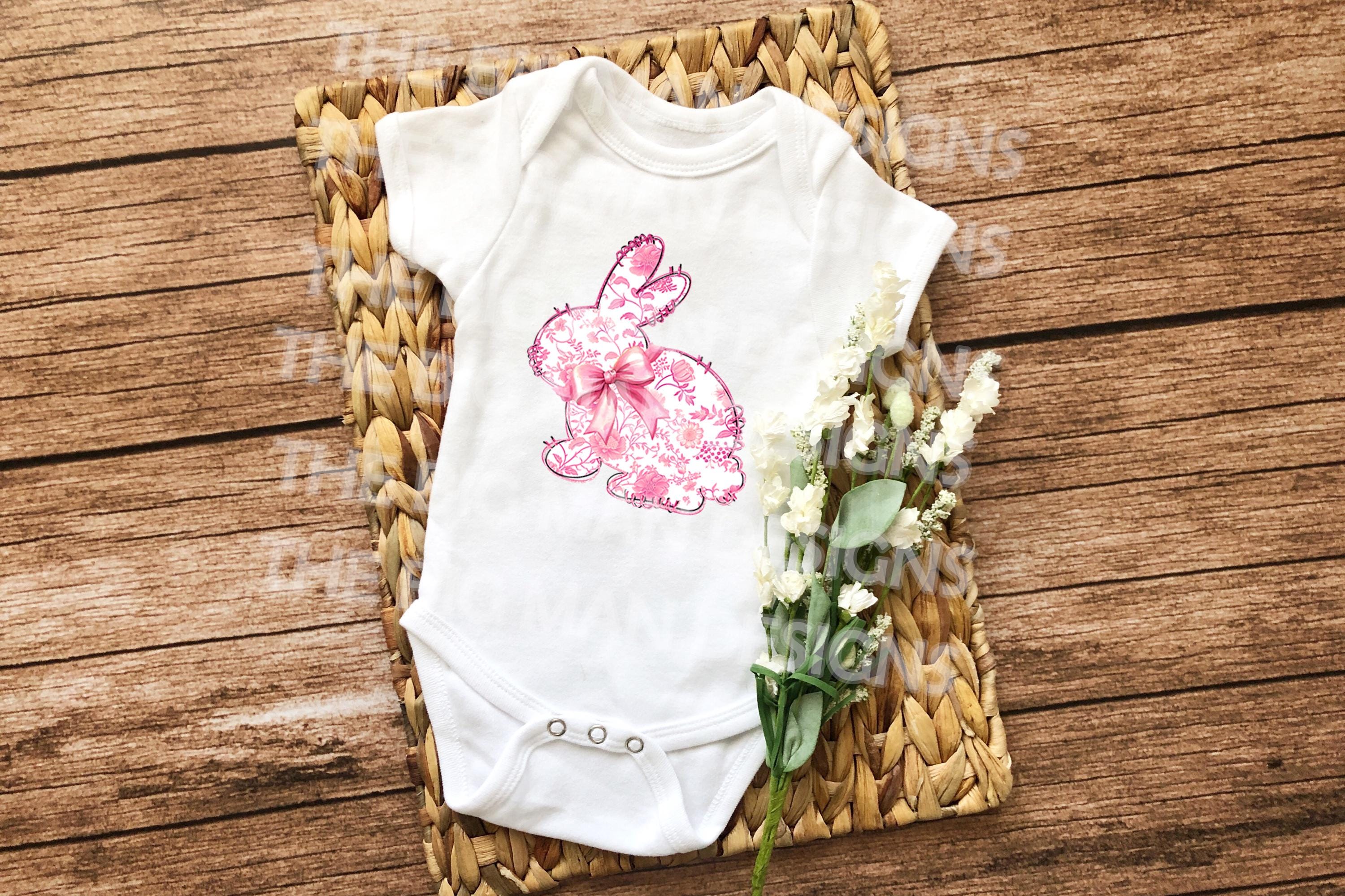 Floral pink toile bunny onesie, featuring an elegant vintage design, perfect for Easter.