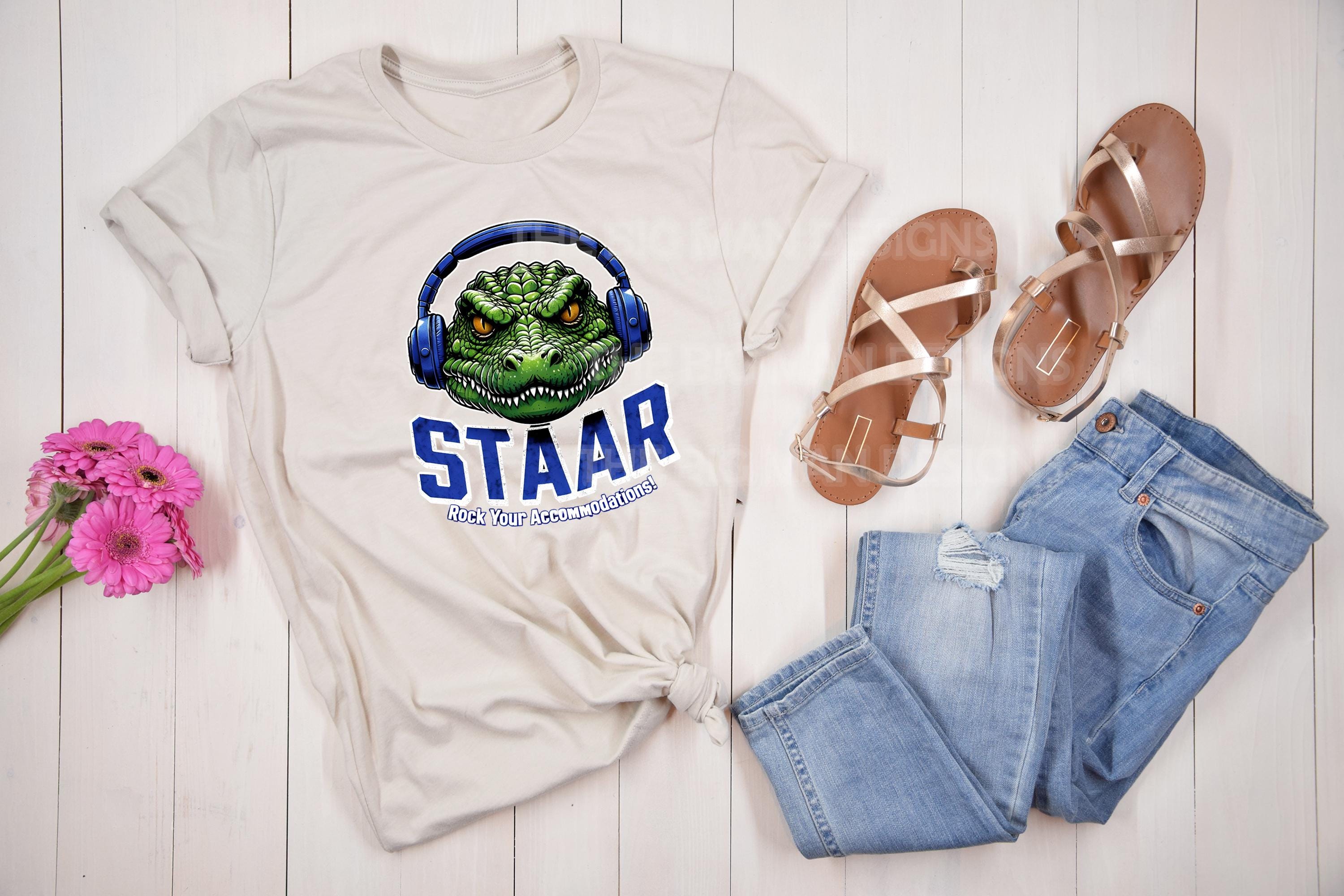 Get ready to rock testing season with our STAAR Rock Your Accommodations T-shirt! Featuring a bold gator head wearing oversized headphones, this shirt is perfect for teachers, administrators, and education staff who want to bring some fun and motivation to test prep. On natural tshirt