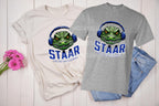 Get ready to rock testing season with this high-quality DTF transfer featuring a gator head wearing headphones and the phrase STAAR Rock Your Accommodations! Perfect for teachers, administrators, and school staff, this ready-to-press transfer makes it easy to create custom shirts for testing season! on grey and natural