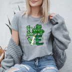 Celebrate St. Patrick’s Day with this adorable "Love" DTF transfer featuring a shamrock as the O in the word “Love”! This festive green design combines the spirit of the holiday with the cuteness of a shamrock, making it perfect for creating lucky St. Patrick's Day outfits. Whether you're heading to a celebration or just want to add a little festive charm to your wardrobe, this ready-to-press DTF transfer is the perfect way to bring some luck and love into your day! on grey