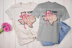Show off your Texas pride with a feminine, coquette twist! This State Floral Coquette Texas DTF transfer features a beautifully hand-drawn Texas silhouette, adorned with delicate floral details and a soft, vintage-inspired aesthetic. Whether you're a proud Texan, a country girl at heart, or just love Southern charm, this design is perfect for rodeo season, boutique apparel, and everyday wear! on natural and sports grey