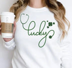A Lucky Stethoscope Shirt designed for nurses, doctors, and medical professionals. This St. Patrick’s Day tee features the word "Lucky" creatively formed with a stethoscope in a high-quality DTF print. Made from 100% cotton, available in sport grey, natural, black, and white. A perfect medical-themed lucky shirt for nurse life, hospital workers, or a St. Paddy’s celebration. Soft, stylish, and durable—no cracking or peeling!