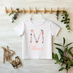 Personalized Floral Initial & Name Baby Bodysuit | Custom Name Onesie | Baby Shower Gift

Celebrate your little one's name with this personalized baby onesie, featuring a beautiful floral initial and a delicate handwritten script name. This custom baby outfit makes the perfect baby shower gift, coming home outfit, or keepsake for a newborn photo shoot.