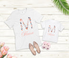 Personalized Floral Initial & Name Baby Bodysuit | Custom Name Onesie | Baby Shower Gift

Celebrate your little one's name with this personalized baby onesie, featuring a beautiful floral initial and a delicate handwritten script name. This custom baby outfit makes the perfect baby shower gift, coming home outfit, or keepsake for a newborn photo shoot.