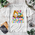 Get ready for Easter with this fun, bright, and colorful "Eggs-Cavator" design! Featuring a playful excavator digging up bright eggs alongside a cute bunny, this DTF transfer is perfect for creating unique Easter-themed shirts. Printed with high-quality Direct-to-Film (DTF) technology, ready to press onto your favorite shirt. Great for Easter gifts, family outings, and more.