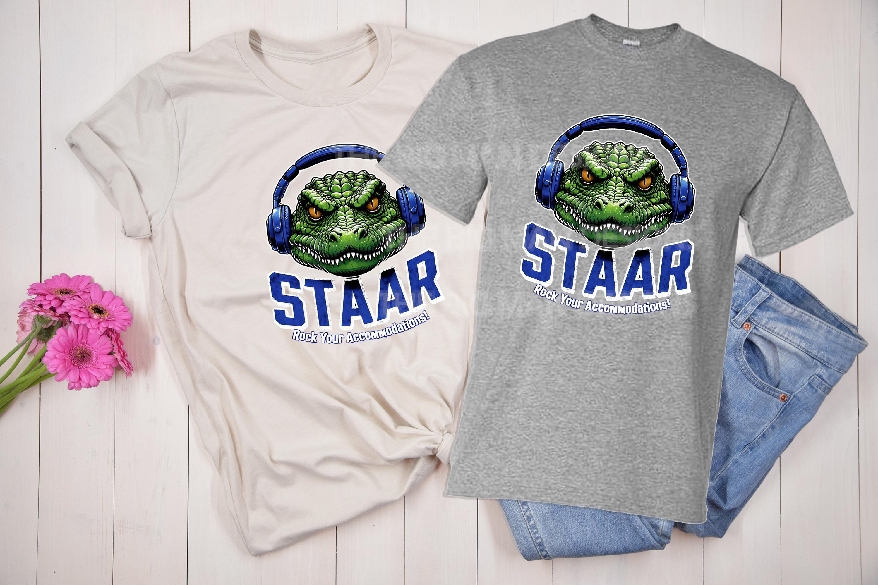 Get ready to rock testing season with our STAAR Rock Your Accommodations T-shirt! Featuring a bold gator head wearing oversized headphones, this shirt is perfect for teachers, administrators, and education staff who want to bring some fun and motivation to test prep. On a grey tshirt and a natural tshirt