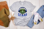 Get ready to rock testing season with this high-quality DTF transfer featuring a gator head wearing headphones and the phrase STAAR Rock Your Accommodations! Perfect for teachers, administrators, and school staff, this ready-to-press transfer makes it easy to create custom shirts for testing season! On grey