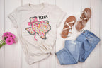 Show off your Texas pride with a feminine, coquette twist! This State Floral Coquette Texas DTF transfer features a beautifully hand-drawn Texas silhouette, adorned with delicate floral details and a soft, vintage-inspired aesthetic. Whether you're a proud Texan, a country girl at heart, or just love Southern charm, this design is perfect for rodeo season, boutique apparel, and everyday wear! on natural