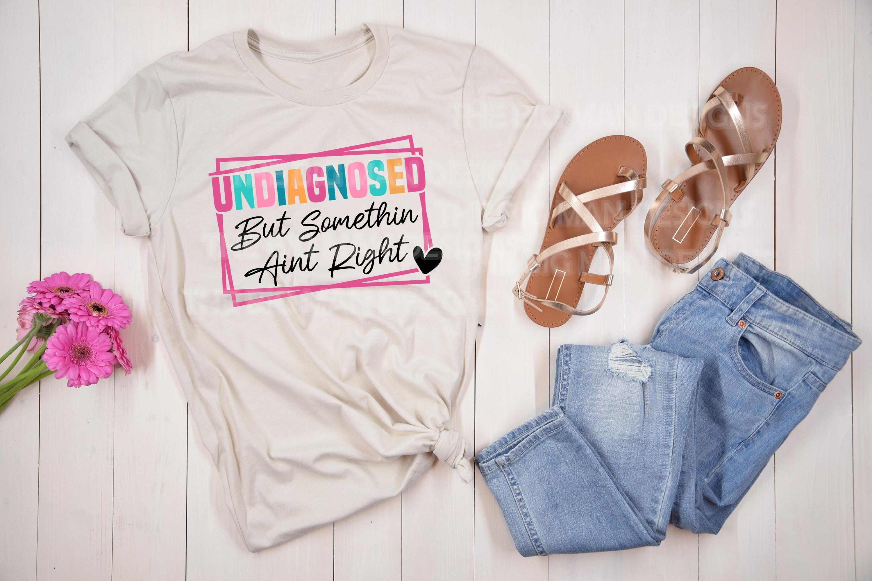 Get a laugh (and some knowing nods) with this "Undiagnosed But Something Ain’t Right" DTF transfer! Perfect for making funny, relatable t-shirts and hoodies, this bold and trendy design is ideal for anyone with a great sense of humor. No weeding, no hassle—just press and go!