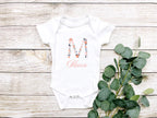 Personalized Floral Initial & Name Baby Bodysuit | Custom Name Onesie | Baby Shower Gift

Celebrate your little one's name with this personalized baby onesie, featuring a beautiful floral initial and a delicate handwritten script name. This custom baby outfit makes the perfect baby shower gift, coming home outfit, or keepsake for a newborn photo shoot.