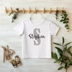 Custom Name Baby Bodysuit | Personalized Baby Boy Outfit | Name Onesie® Toddler & Youth Tee

Make your little one’s outfit extra special with this personalized name onesie featuring a bold capital letter and a stylish script name underneath. This custom baby bodysuit is a thoughtful baby shower gift, newborn coming home outfit, or a unique keepsake for first birthdays and photo shoots. toddler tshirt