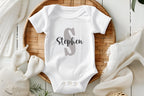 Custom Name Baby Bodysuit | Personalized Baby Boy Outfit | Name Onesie® Toddler & Youth Tee

Make your little one’s outfit extra special with this personalized name onesie featuring a bold capital letter and a stylish script name underneath. This custom baby bodysuit is a thoughtful baby shower gift, newborn coming home outfit, or a unique keepsake for first birthdays and photo shoots.