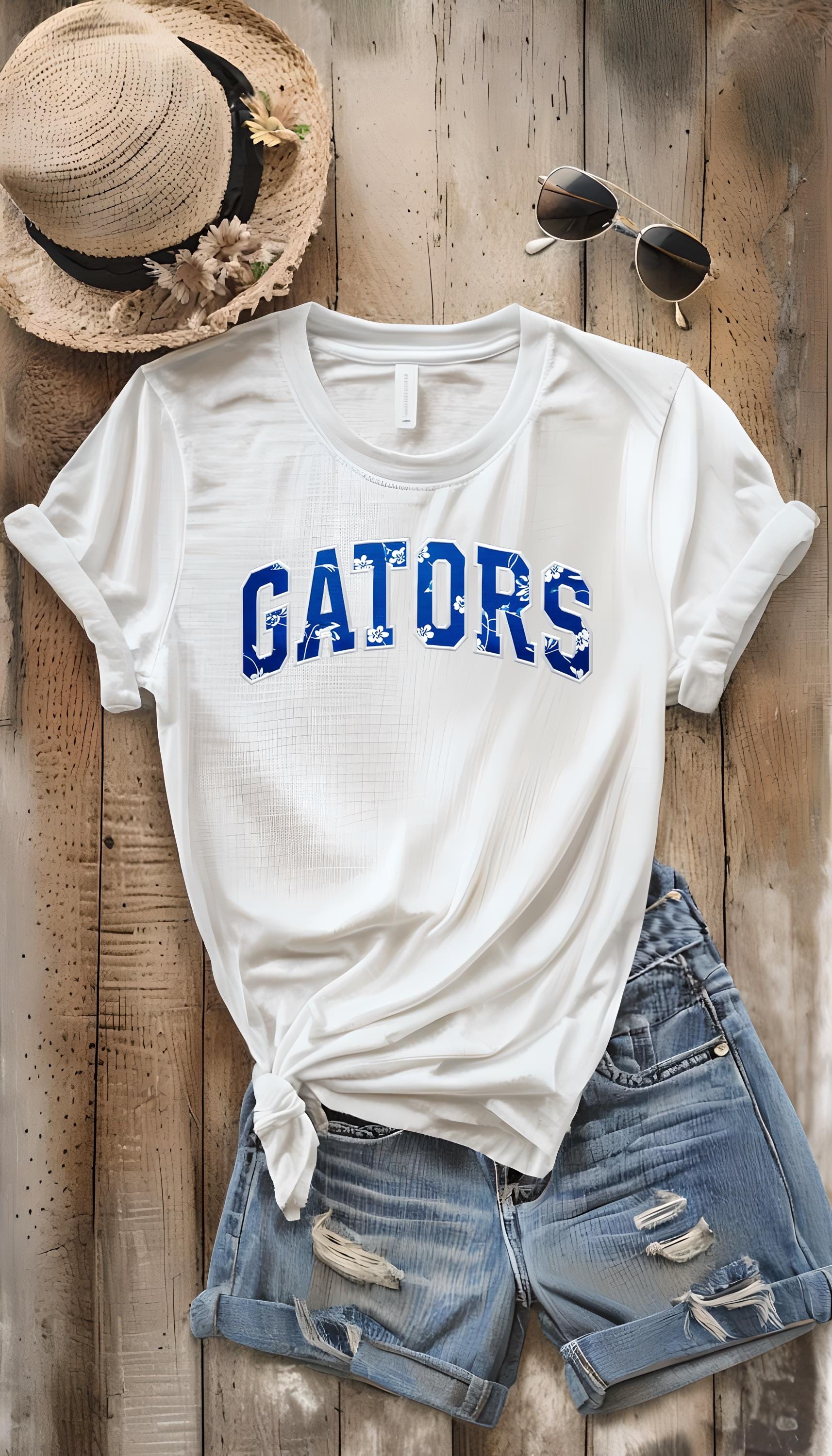 Gators Floral Print T-Shirt & Sweatshirt – Stylish DTF Printed Design
🌸 Show your Gator pride with a stylish floral twist! 🌸

This Gators Floral Print T-Shirt & Sweatshirt is the perfect blend of school spirit and trendy fashion. Featuring the word "Gators" in a beautiful floral print, this design is perfect for game days, casual wear, or as a gift for any proud Gator fan! Made with high-quality DTF printing, this design is vibrant, durable, and long-lasting.