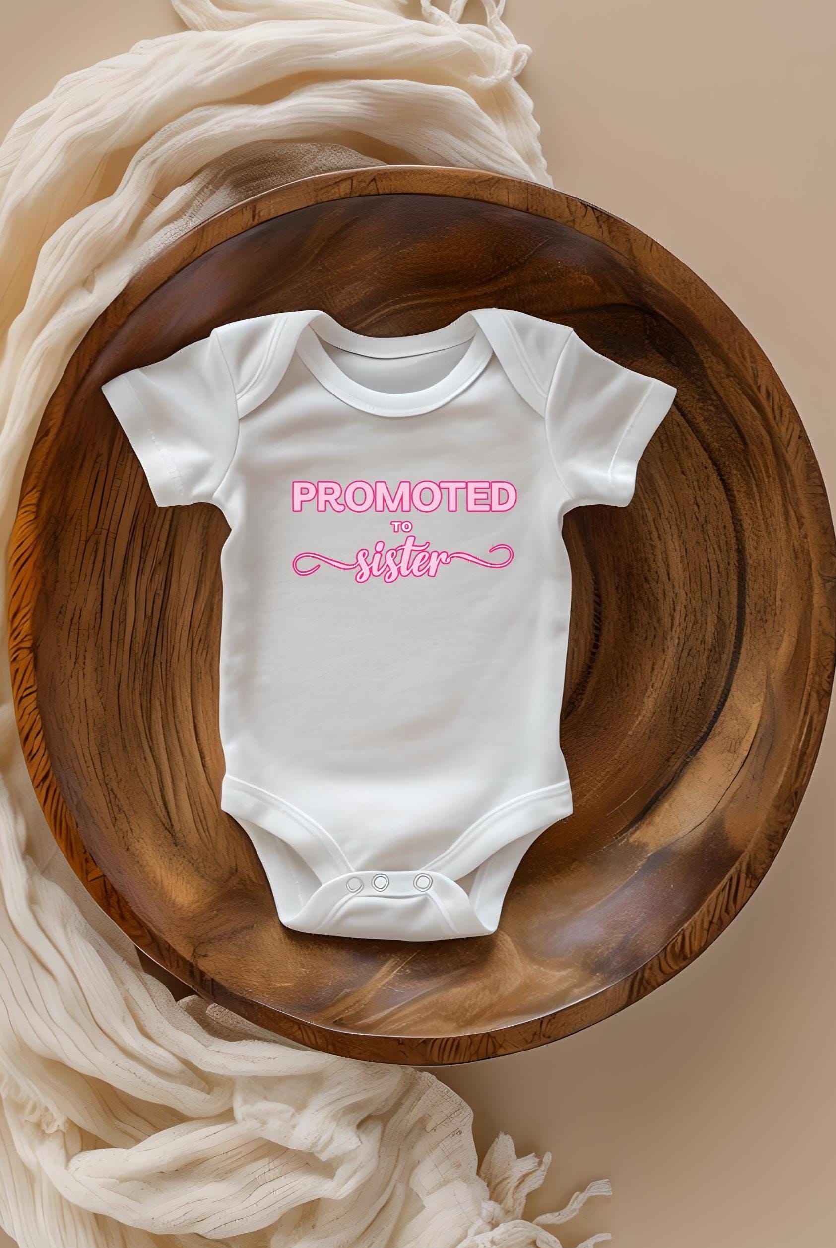 Promoted to Sister Onesie – New Sibling Announcement | Baby Sister Reveal Gift | Cute Family Announcement Bodysuit

Description:
🎀👶 Promoted to Sister! 🎉 Make your new family announcement extra special with this adorable onesie! Celebrate becoming a big sister or introduce your new arrival with this sweet, stylish bodysuit, perfect for unforgettable photos and family moments.