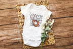 It's Game Day, and your little MVP is ready to cheer! ⚾🥎

Our "Game Day" design is available as either a cozy Gerber® baby onesie or a soft toddler T-shirt — perfect for family game days, sibling sports events, or baby's first trip to the ballpark.

Featuring a fun glove and baseball graphic, this outfit is a home run for any little fan in training! Ideal for photo ops, game day parties, or a cute and casual everyday look.