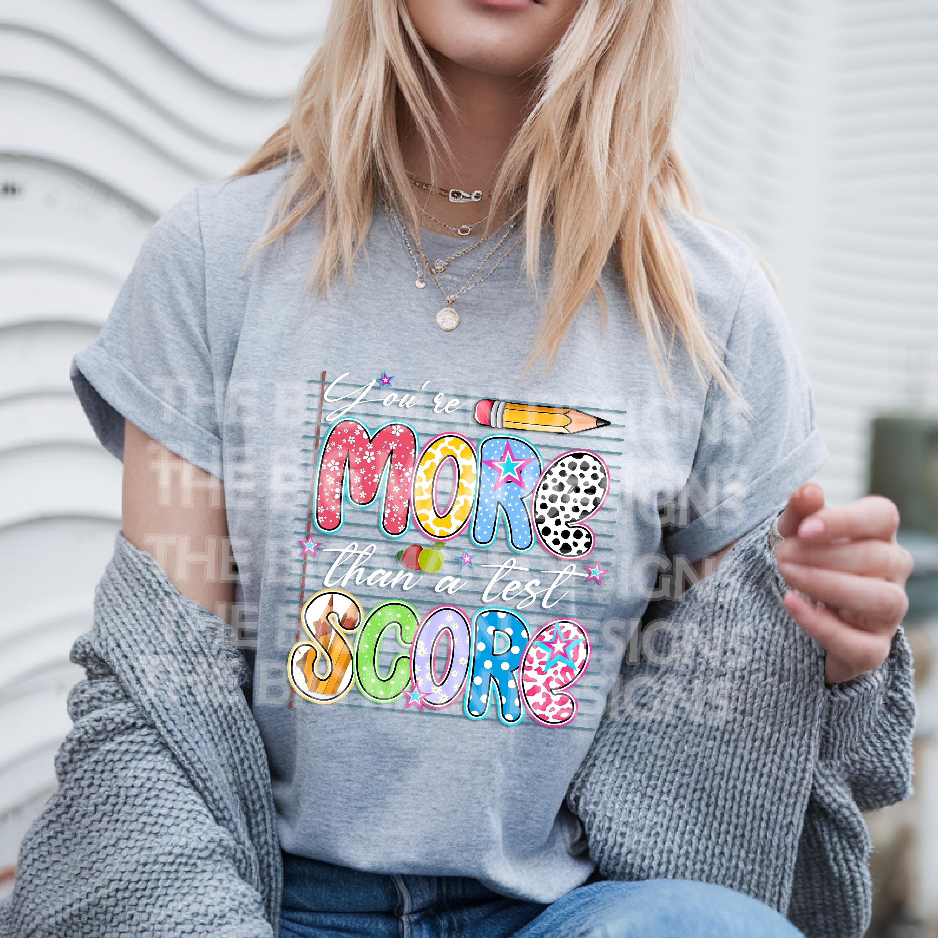 More Than a Test Score Teacher Shirt | Motivational School Staff Shirt | Testing Season Encouragement Tee

Description:
🎓 Remind every student that they are so much more than a number!
Our "More Than a Test Score" teacher T-shirt is the perfect comfy and colorful addition to your classroom or testing day outfits. Great for STAAR testing, finals season, and everyday encouragement!