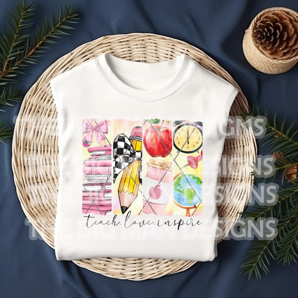 Folded white t-shirt displayed in a wicker tray with festive "Teach Love Inspire" print.