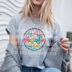 "Teacher graphic on grey tshirt worn by smiling woman"